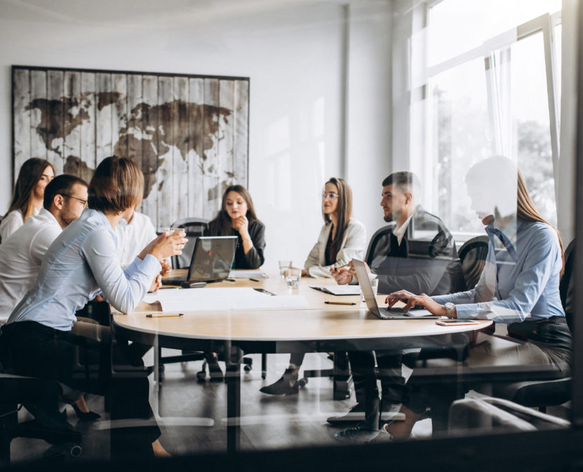 Group of people working out business plan in an office